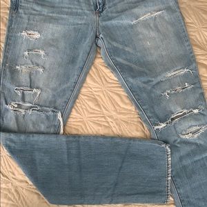 Used distressed jeans with minor paint marks